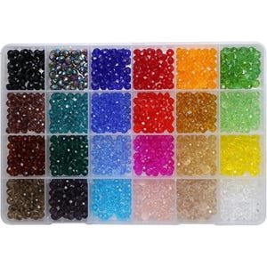 May include: A clear plastic organizer filled with various colors of faceted beads. The beads are arranged in square compartments, showcasing colors like black, blue, red, orange, green, and yellow. Ideal for jewelry making and crafting.