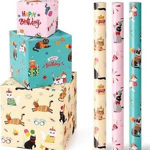 May include: Gift boxes and wrapping paper rolls featuring cat illustrations. The boxes are wrapped in pink, teal, and tan paper with "Happy Birthday" text. The rolls display cats with party hats and cake.