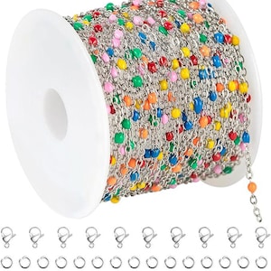 May include: A spool of colorful beaded chain with a silver-tone finish. The beads are in various colors, including red, yellow, green, blue, and pink. Also included are silver-tone lobster clasps and jump rings, perfect for jewelry making.