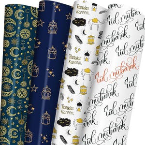 May include: Four rolls of decorative wrapping paper with Islamic-themed designs. Patterns include gold moons and stars on navy, gold lanterns and stars on navy, and white paper with camels, lanterns, and the text "Ramadan Kareem" and "Eid Mubarak".