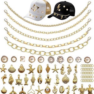 May include: A selection of gold-coloured jewellery components and two trucker caps. The caps are white and black with gold accents. The jewellery includes chains, charms, and pearl-like beads with sea-themed designs.