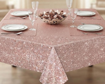 May include: A rose gold sequin tablecloth with a sparkling finish, set with white plates, clear glass goblets, and silver cutlery. A decorative bowl filled with metallic pinecones sits in the centre. The text ThewhimsywonderGifts is visible.