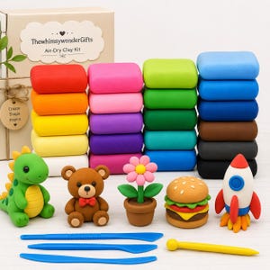 May include: An air-dry clay kit with colorful clay blocks and clay figures. The kit includes a green dinosaur, a brown teddy bear, a flower in a pot, a hamburger, and a rocket. The box reads "ThewhimsywonderGifts Air-Dry Clay Kit."