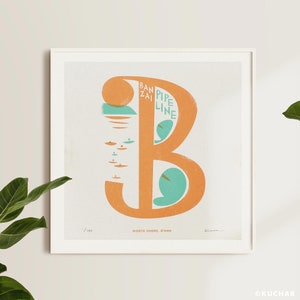 May include: A framed print of a stylised letter "B" in orange with a turquoise wave design. The text "Banzai Pipeline" is written vertically inside the letter. The text "North Shore, O'ahu" is written below the letter.