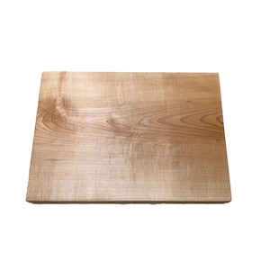 May include: A rectangular wooden cutting board with a light brown color and visible wood grain. The board is made of a single piece of wood and has a smooth surface. The cutting board is ideal for food preparation.