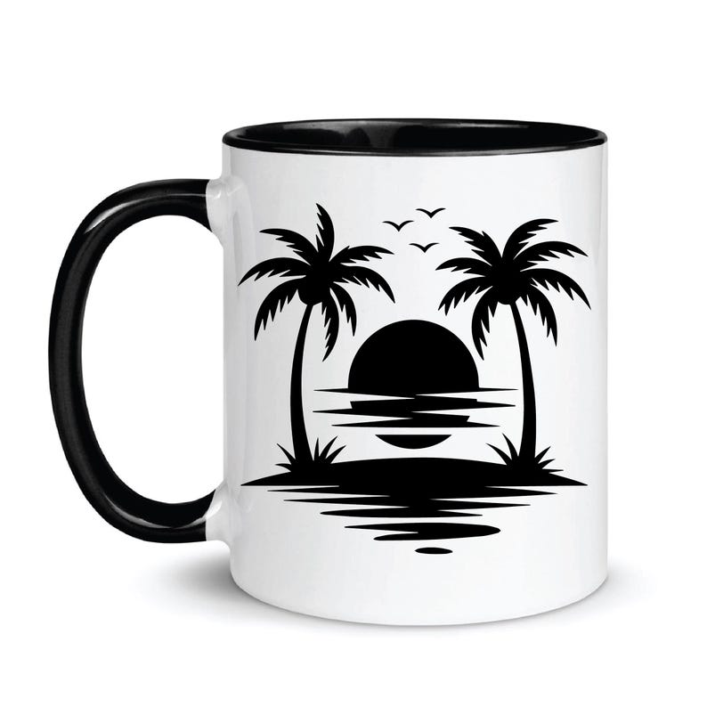 May include: White ceramic mug with a black interior and handle. The mug features a black silhouette design of a sunset over the ocean with palm trees and birds. A perfect gift for beach lovers.