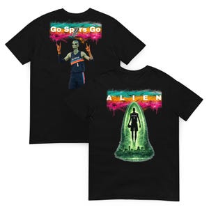 May include: Black t-shirts with unique graphics. One shirt features an alien in a basketball uniform with the text "Go Spurs Go". The other shirt has an alien silhouette with the word "ALIEN".