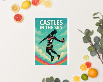 May include: Poster featuring a basketball player in mid-air, silhouetted against a sky-themed background. The player wears a jersey with the number 5 and colorful stripes. The text "CASTLES IN THE SKY" is at the top. The poster is surrounded by fruit.