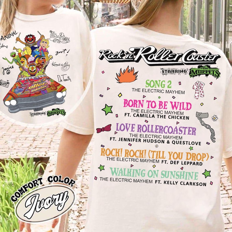 May include: Ivory t-shirt with a Muppets roller coaster graphic and song titles like "Born to be Wild". The text includes "Rockin' Roller Coaster" and "Comfort Color Ivory".