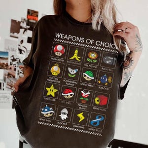 vintage Nintendo Super Mario Kart armes de choix article affiche T-shirt Universal Studios Hollywood Trip, t-shirt Mario icône complète