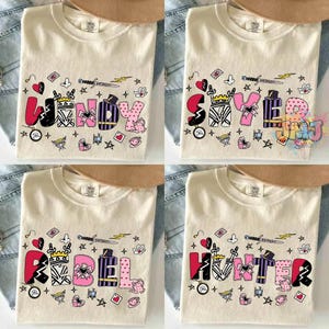 May include: Four cream-colored t-shirts featuring custom names in large, stylized letters. Each letter is decorated with unique patterns like stripes, hearts, and crowns. Surrounding the names are small graphic icons including swords, hearts, stars, and teacups.