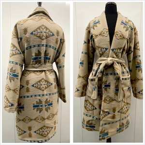 May include: A long, beige robe with a geometric pattern in shades of blue and brown. The robe has a shawl collar, a tie belt, and two pockets.
