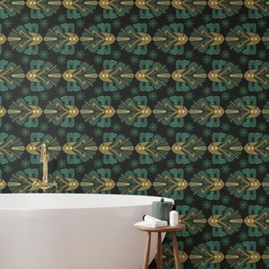 May include: Wallpaper featuring a repeating geometric pattern of stylized fish in shades of teal, gold, and dark green on a black background. The design includes small star-like accents between the fish motifs, creating a symmetrical layout.