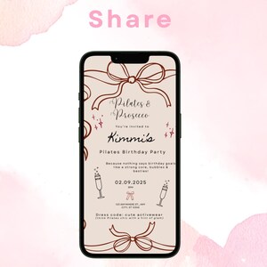 May include: A smartphone displays a Pilates & Prosecco birthday party invitation. The invitation features text and decorative bows in brown tones against a light beige background. The background is a pink watercolor wash.