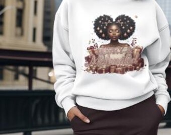 May include: White sweatshirt featuring a graphic of a Black woman with an afro, surrounded by gifts and the text "Merry & Unlimited" in a festive font. The sweatshirt has long sleeves and a crew neck.