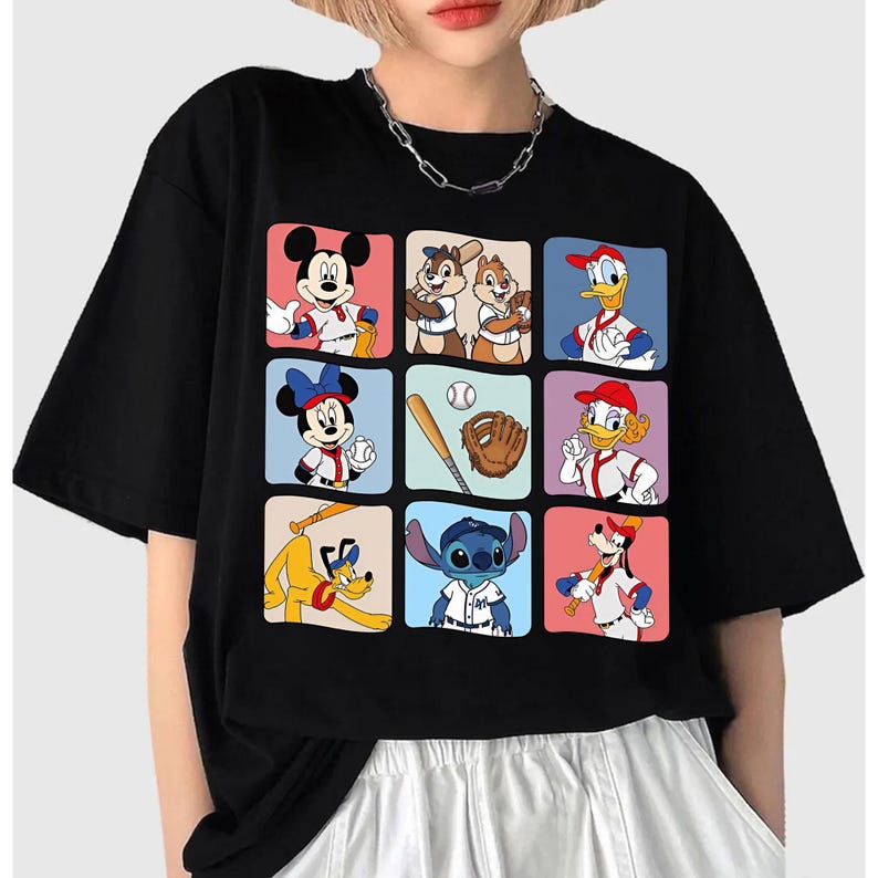 May include: Black t-shirt featuring a grid of cartoon characters in baseball uniforms. Mickey Mouse, Minnie Mouse, Donald Duck, and other Disney characters are depicted. A baseball bat, ball, and glove are also shown.