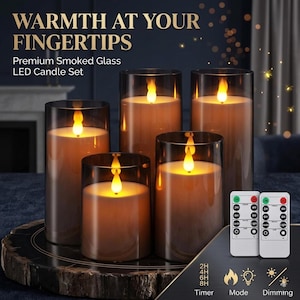 May include: A set of five LED candles with a smoked glass design. The candles have a realistic flickering flame effect and come with two remote controls. Text on the image reads "WARMTH AT YOUR FINGERTIPS" and "Premium Smoked Glass LED Candle Set."
