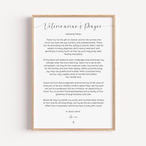 May include: A framed print displaying the "Veterinarian's Prayer" in a stylish script. The text is set against a white backdrop, encased in a light brown wooden frame. The prayer is a sincere expression of care and commitment.