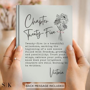 May include: A light gray book cover featuring the text Chapter Twenty-Five, a line drawing of a flower bouquet with a small pink ribbon, and a paragraph about milestones. The name Victoria is printed at the bottom in a cursive script font.