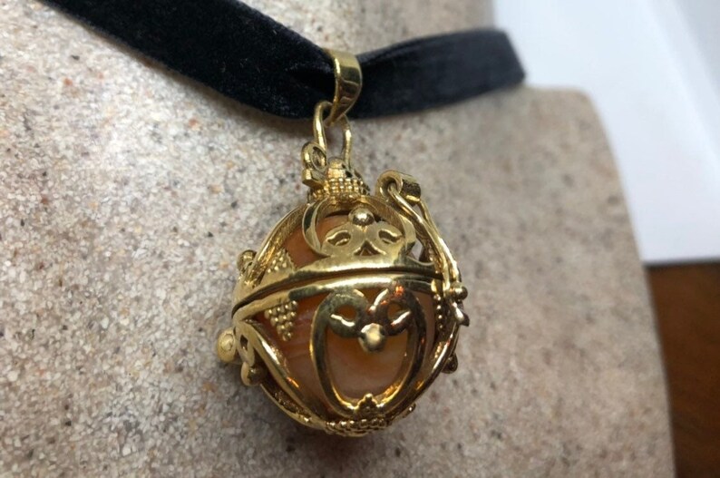 Vintage Golden Bronze Healing Stone Cage Locket image 1