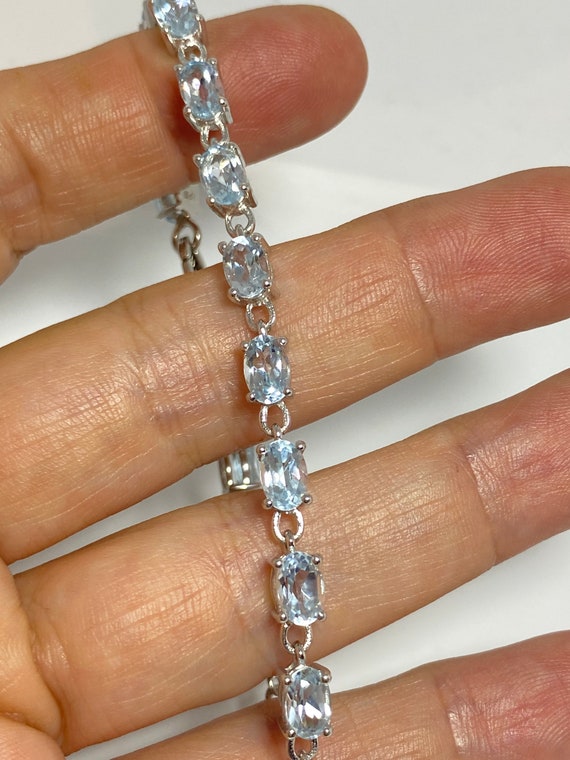 Gem Stone King Aquamarine Sterling Silver Women's Ring - 0.83 Ct Round Cut Sky Blue Stone, Sizes 5-9