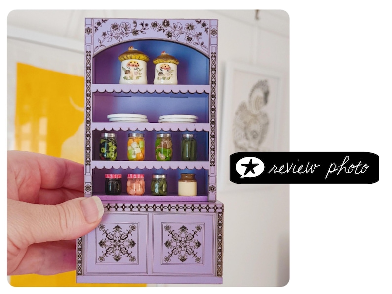 laser cut dollhouse bookshelf with intricate engravings and scalloped shelves