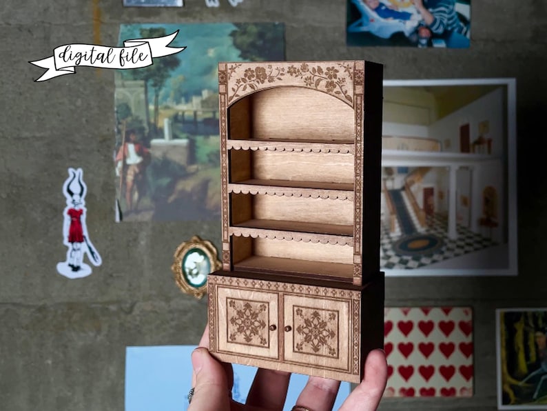 laser cut dollhouse bookshelf with intricate engravings and scalloped shelves