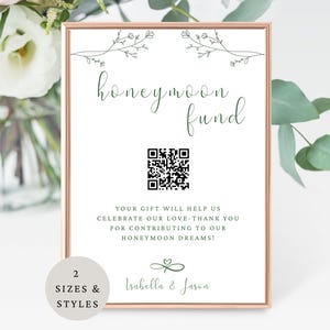 May include: A framed sign with the words "honeymoon fund" in green script. The sign includes a QR code and the names "Isabella & Jason". The text reads "Your gift will help us celebrate our love - thank you for contributing to our honeymoon dreams!"