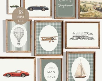May include: A set of 18 framed wall art prints featuring vintage transportation themes including a red sports car, a blue convertible, a hot air balloon, a biplane, a sailboat, and a steam train, alongside text prints reading Long Live Boyhood.