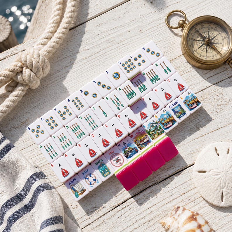 May include: A set of white rectangular mahjong tiles featuring nautical-themed illustrations including sailboats, lighthouses, oars, and lifebuoys, arranged in a grid with several solid magenta tiles at the bottom right corner.