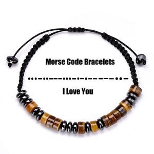 May include: A black cord bracelet with a sliding knot closure. The bracelet features a Morse code design with brown and silver beads spelling "I Love You". The text "Morse Code Bracelets" and "I Love You" are displayed above and below the bracelet.