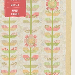 May include: A floral quilt with a repeating pattern of stylized flowers and leaves in shades of pink, green, and yellow. The quilt features the text "MAISY DAISIES" and "PATTERNS BY moda". The quilt has a cream-colored background and a yellow border.