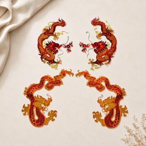May include: Four embroidered dragon patches arranged in two pairs. The top pair features red and gold dragons with teal accents, while the bottom pair displays dragons in shades of orange, red, and gold with intricate scale and claw detailing.