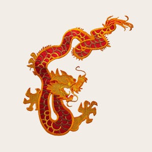 May include: Embroidered dragon in red and gold. The dragon is depicted in a sinuous pose, with intricate detailing on its scales, claws, and flowing mane. The design is set against a cream-colored background.