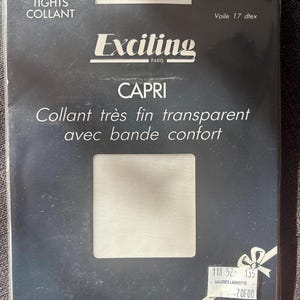 May include: A package of white sheer tights labeled Exciting Paris Capri. The packaging features the text Collants, Strumpfhosen, Tights, Collant, Taille/Gr. 2 Blanc, Voile 17 dtex, and Collant très fin transparent avec bande confort.