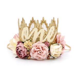 Boho first birthday crown in gold with ivory cursive "one" lettering and a boho mix of florals in blush, dusty pink, and ivory. It's perfect for photos shoots, birthday parties, and celebrations. LoveCrush Crowns