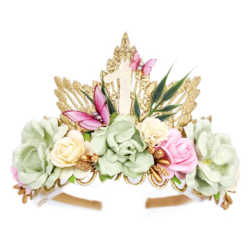 Gold lace tiara adorned with sage green, soft pink, and ivory faux flowers, delicate organza butterflies, and golden leaves. Perfect for baby girl or toddler girl fairy-themed birthdays, photoshoots, or special occasions. Handcrafted with attention to detail for a whimsical and elegant boho look. Fairy First Birthday