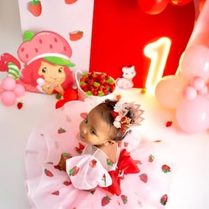Pink lace strawberry first birthday crown with red and blush flowers, glittery strawberry topper, and delicate lace details, perfect for cake smash, milestone photos, and baby girl first birthday celebrat