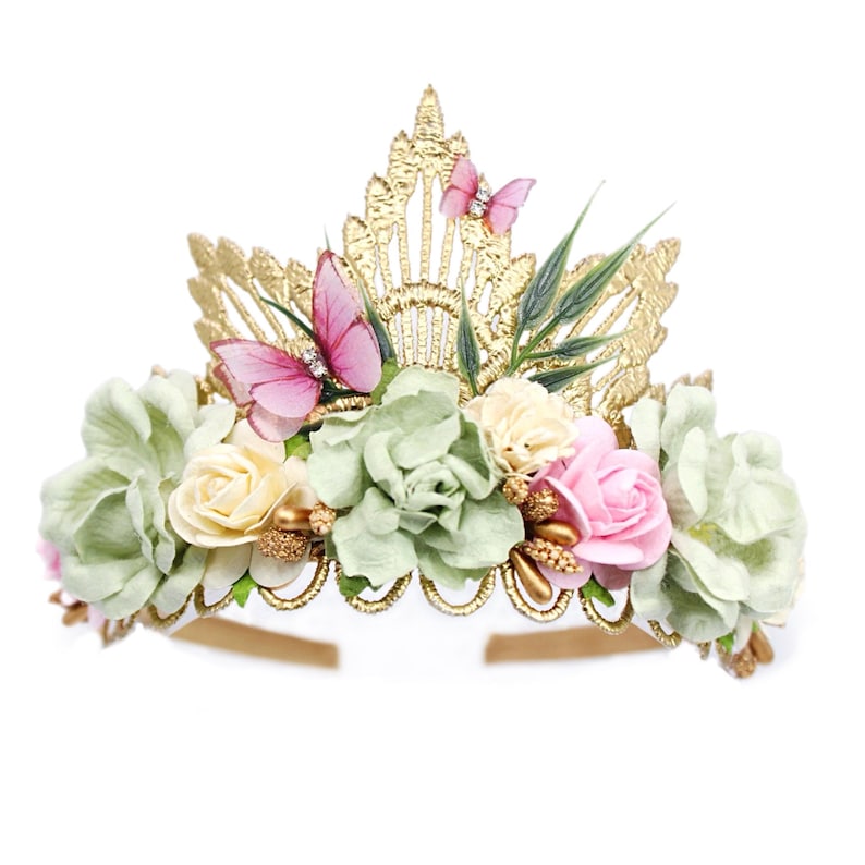 Gold lace tiara adorned with sage green, soft pink, and ivory faux flowers, delicate organza butterflies, and golden leaves. Perfect for baby girl or toddler girl fairy-themed birthdays, photoshoots, or special occasions. Handcrafted with attention to detail for a whimsical and elegant boho look.