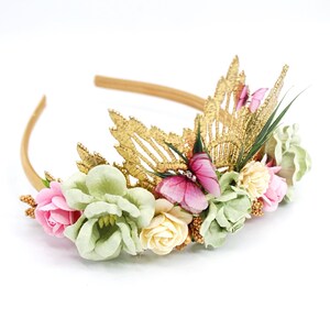 Gold lace tiara adorned with sage green, soft pink, and ivory faux flowers, delicate organza butterflies, and golden leaves. Perfect for baby girl or toddler girl fairy-themed birthdays, photoshoots, or special occasions. Handcrafted with attention to detail for a whimsical and elegant boho look.