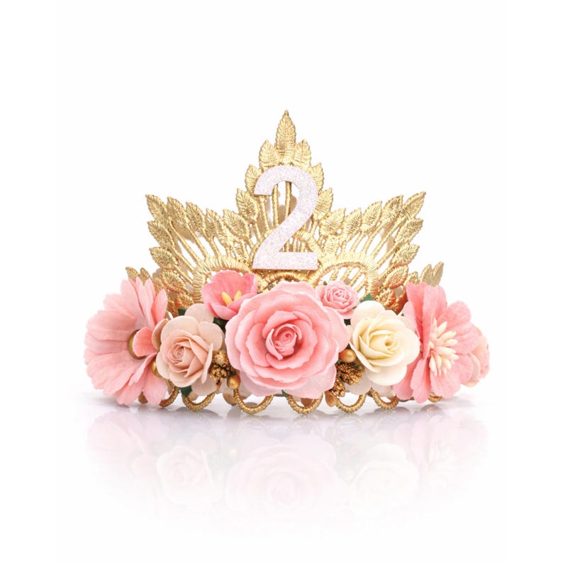 Second birthday crown with pink and ivory flowers on reflective white surface, gold floral tiara with glitter number 2, toddler birthday crown, girl cake smash crown, princess party headband, age 2 photo prop, handmade birthday tiara, made in USA