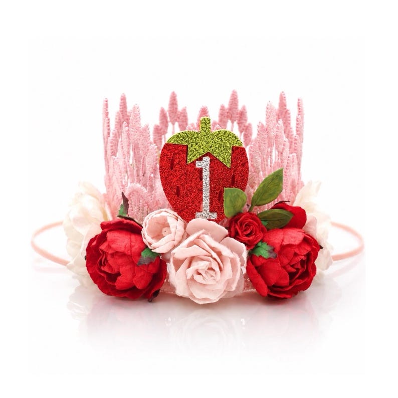 Berry First Birthday Crown with pink lace tiara design, strawberry centerpiece, red and blush florals, and rhinestone number one for cake smash photos, berry sweet birthday parties, and first birthday celebrations.