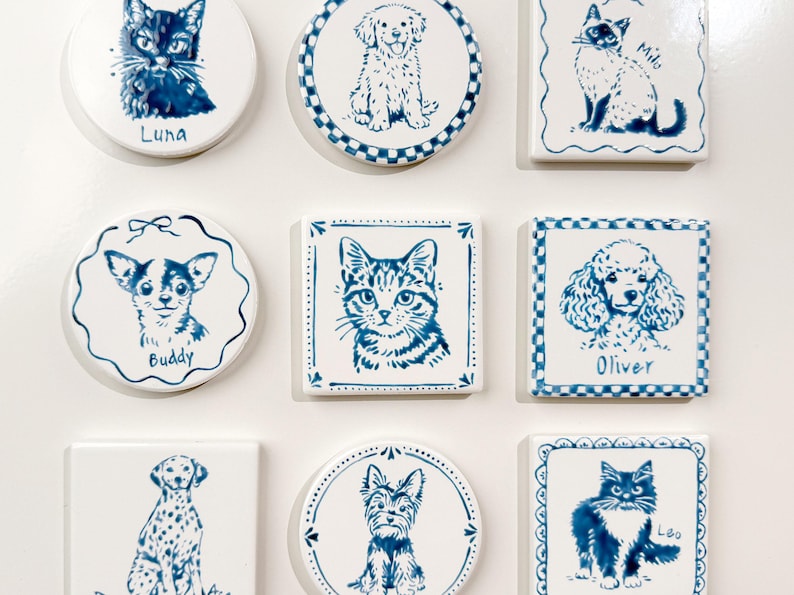 Grid of blue-and-white custom pet portrait magnets on a white background, featuring hand-drawn cats and dogs in round and square ceramic designs.