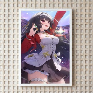May include: A framed anime-style print featuring a female character with long black hair and pink eyes. She wears a white and black dress with gold star accents and a red jacket. The background shows a blurred stadium setting.