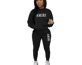 Completo da donna Amiri composto da felpa con cappuccio e pantaloni della tuta