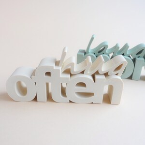 3D printer files home decoration set featuring a Hug Often sign with 3D lettering print file