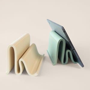 3D printed tablet stand for workspace organization.