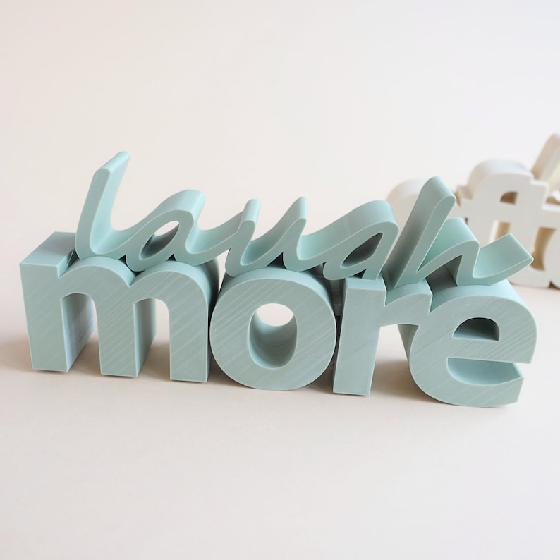 Motivational Laugh more sign printed decor created using commercial STL 3D printer files.
