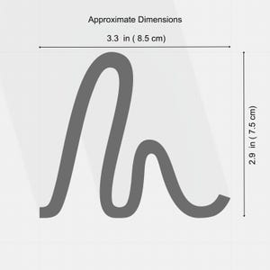 May include: A gray, abstract design with approximate dimensions of 3.3 inches (8.5 cm) wide and 2.9 inches (7.5 cm) tall. The design has a flowing, curved shape.