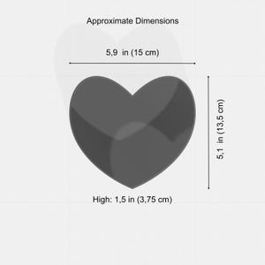 May include: A dark gray heart-shaped object with approximate dimensions of 5.9 inches (15 cm) wide, 5.1 inches (13.5 cm) high, and 1.5 inches (3.75 cm) thick. The image includes the text "Approximate Dimensions".